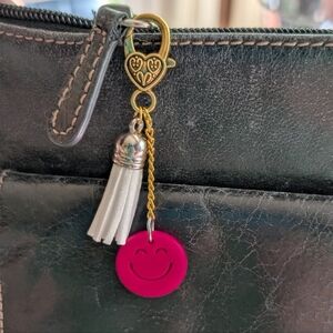 Gold and Pink Smiley Bag Charm with White Tassel